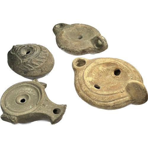 26 - Collection of Roman Pottery Oil Lamps. Circa 1st-5th century AD. 74 - 112 mm. Four lamps from variou... 