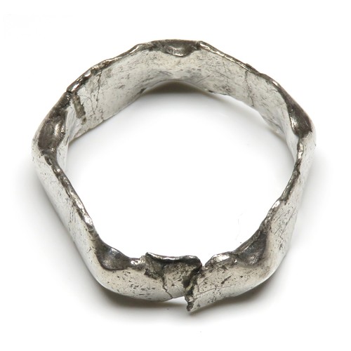 24 - Roman silver finger ring. Broken across one panel. 21mm diameter x 9mm, 3.5g. Approximate ring size ... 