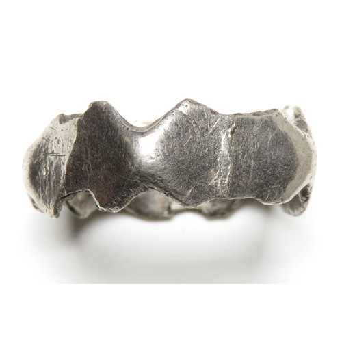 24 - Roman silver finger ring. Broken across one panel. 21mm diameter x 9mm, 3.5g. Approximate ring size ... 