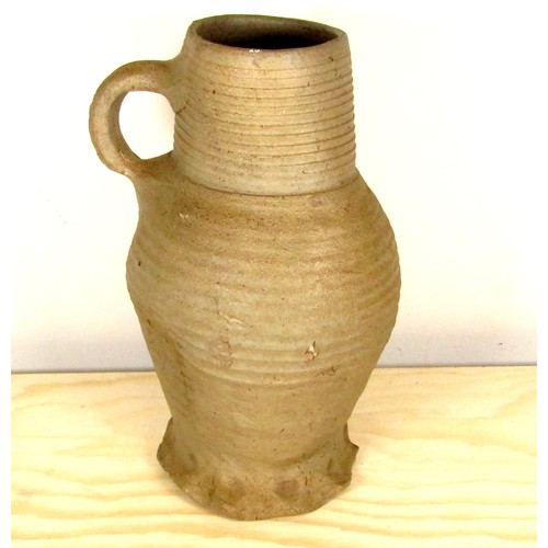 101 - English Medieval Pottery Jug. Circa, 13th-14th century AD. 210 x 82 mm. A tall baluster type jug wit... 