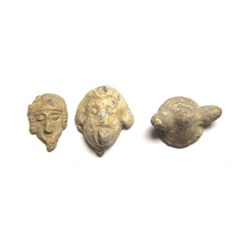 105 - Medieval Artefacts Group (3). C. 10-14th AD. Lead, 18 mm - 23 mm. A tri-lobe type gaming piece, a we... 