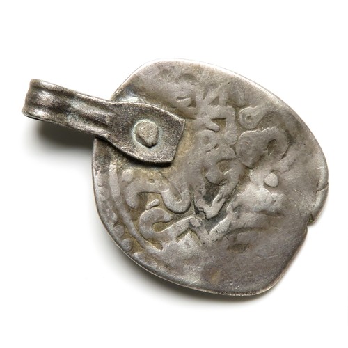 60 - Early medieval silver coin pendant. 29mm x 20mm, 2.86g. An Eastern / Islamic coin pierced with an ad... 