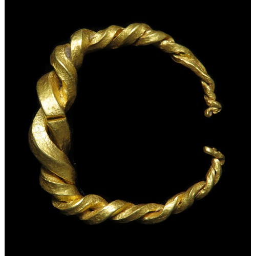 66 - Viking gold ring c. AD 875 - 1100. A gold finger ring composed of two tapering, square-sectioned rod... 