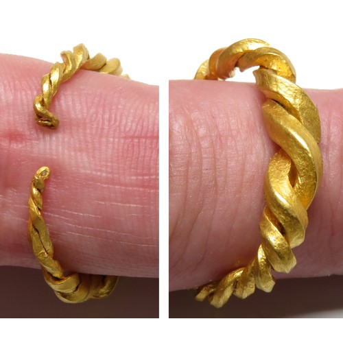 66 - Viking gold ring c. AD 875 - 1100. A gold finger ring composed of two tapering, square-sectioned rod... 