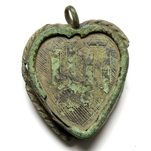 71 - Medieval Reliquary Pendant. Circa, 15th-16th century AD. Copper-alloy, 41mm x 34mm. 13.9g. A heart-s... 