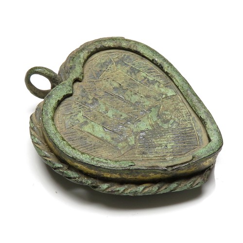 71 - Medieval Reliquary Pendant. Circa, 15th-16th century AD. Copper-alloy, 41mm x 34mm. 13.9g. A heart-s... 