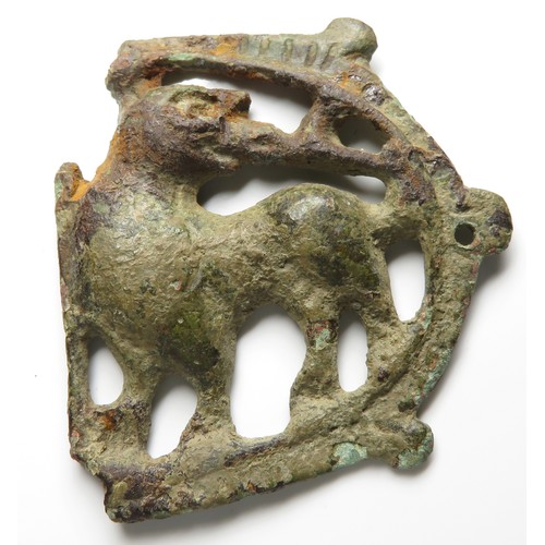 84 - Medieval mythical beast mount. Circa, 13th century AD. Copper-alloy, 44mm x 40mm, 15.6g. A decorativ... 