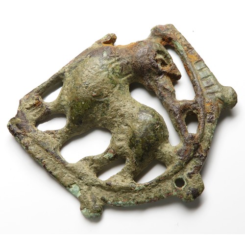 84 - Medieval mythical beast mount. Circa, 13th century AD. Copper-alloy, 44mm x 40mm, 15.6g. A decorativ... 