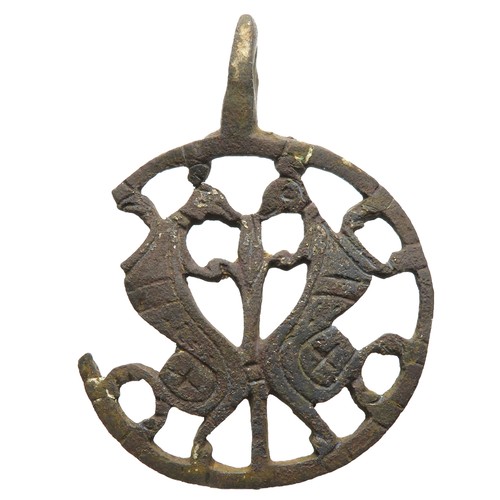 76 - Medieval zoomorphic harness pendant. Circa 12th-13th century AD. Copper-alloy, 51mm x 41mm diameter,... 