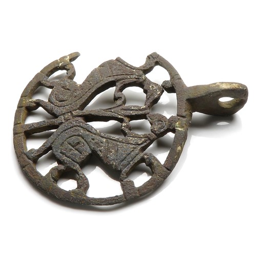 76 - Medieval zoomorphic harness pendant. Circa 12th-13th century AD. Copper-alloy, 51mm x 41mm diameter,... 