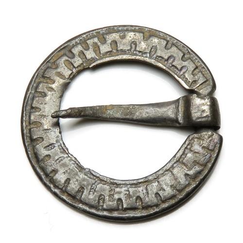 122 - Medieval silver annular brooch c. 13th - 14th century, the body having zigzag decoration contained b... 