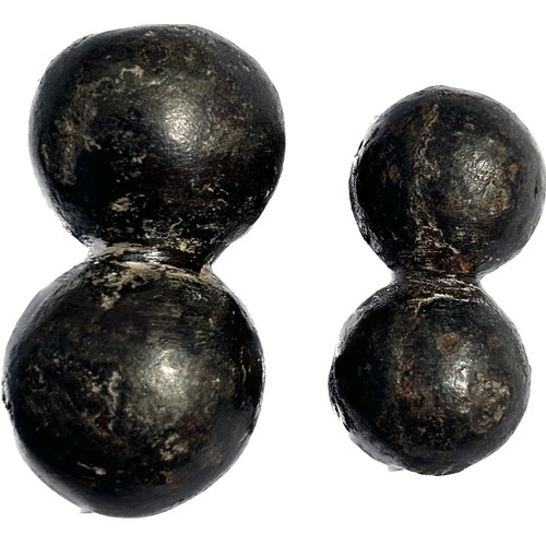 141 - Iron Projectiles. 18th century, 39 mm & 49 mm.  Two cast iron double-shot / bar shot, fired from... 