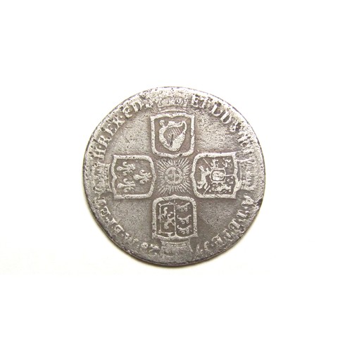 369 - George II Shilling. Silver, 5.57g. 26 mm. Young laureate bust left. R. Plain angles, 1728. Ref: Spin... 