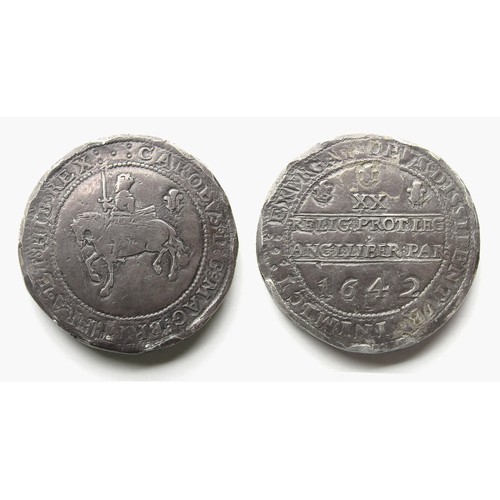 Charles I Shrewsbury Pound. 1642. Silver, 95.88g. 51.48 mm. King on horseback left, plume behind. CAROLVS D G MAG BRIT FRA ET HIB REX, five pellets. R. Declaration, RELIG PROT LEG ANGL LIBER PAR, between two straight lines, XX mark of value with three plumes above. 1642 below. Ref: Brooker, 796. Plate LXVIII. A die match to this published example. Spink 2917.