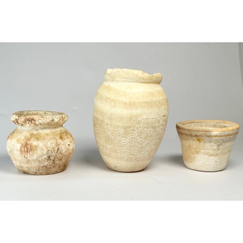 34 - A Group of Ancient Alabaster Vessels (3). Circa 2600-2400 BCE. Size: 30mm-60mm. Cosmetic / oil pots.... 