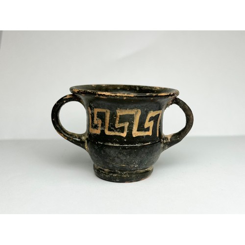 16 - Ancient Greek Minature Skythos Drinking-Vessel. Circa 4th century BCE. 42mm x 50mm. A twin handled t... 