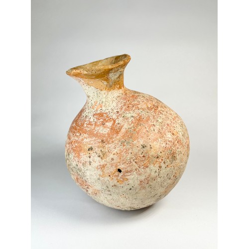 45 - Bronze Age Pottery Flask. Circa 1st millenium BCE. 133mm x 107mm. A polished red ware vessel formed ... 