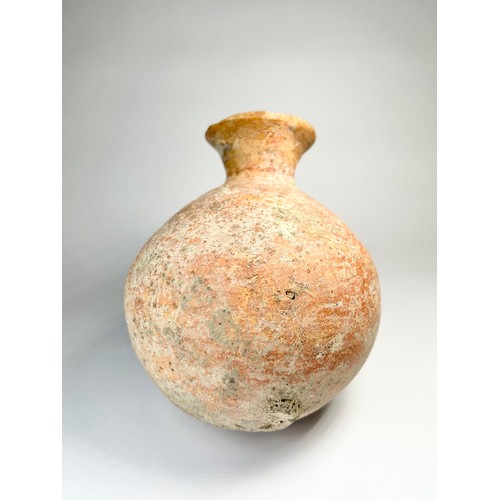 45 - Bronze Age Pottery Flask. Circa 1st millenium BCE. 133mm x 107mm. A polished red ware vessel formed ... 