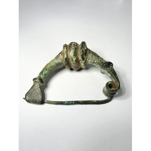 28 - Ancient Greek Brooch. Circa 6th-5th century BCE. Copper-alloy, 75mm x 25mm 111.42 grams. An impressi... 