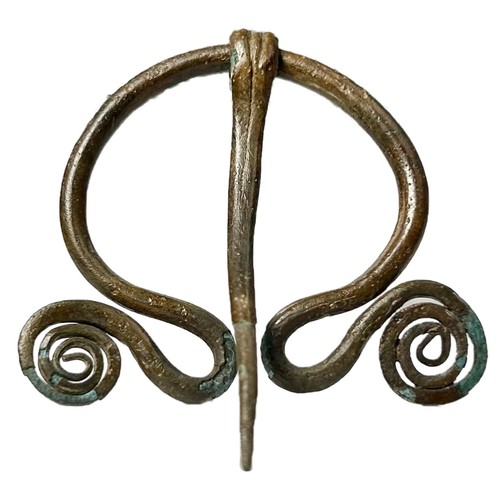 52 - Iron Age Pennnular Brooch. Circa 1st century BCE. Copper-alloy, 44mm x 41mm 6.40g. A plain ring with... 