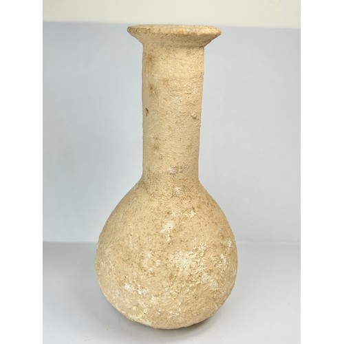 66 - Roman Terracotta Bottle. Circa 3rd century CE. 132mm x 65mm. A pottery vessel with bolbous body and ... 