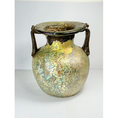 71 - Roman Glass Twin Handled Flask. Circa 3rd / 4th century CE. 98mm x 82mm. A beautifully well preserve... 