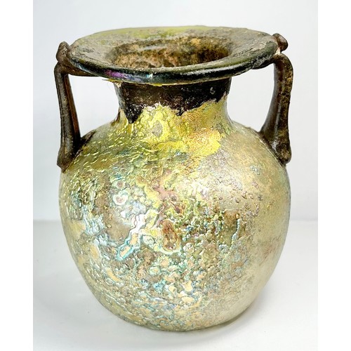 71 - Roman Glass Twin Handled Flask. Circa 3rd / 4th century CE. 98mm x 82mm. A beautifully well preserve... 