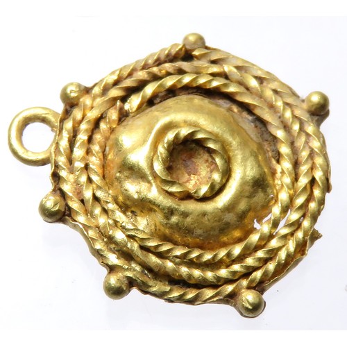 88 - Roman Gold Pendant. Circa 3rd century CE. 17mm x 15mm 1.39g. A circular pendant formed of three conc... 