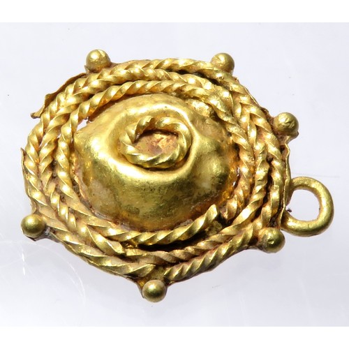 88 - Roman Gold Pendant. Circa 3rd century CE. 17mm x 15mm 1.39g. A circular pendant formed of three conc... 