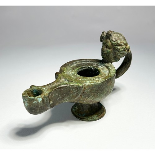 64 - Greco Roman Oil Lamp. Circa 1st century CE. Copper-alloy, 93mm x 37mm 130.40 grams. An impressive br... 