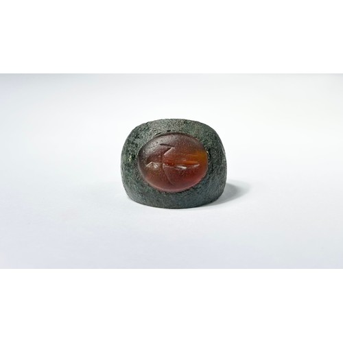 92 - Roman Bronze Intagllio Ring. Circa 3rd-4th century CE. Ring size: UK, H. US; 4. A wide copper-alloy ... 