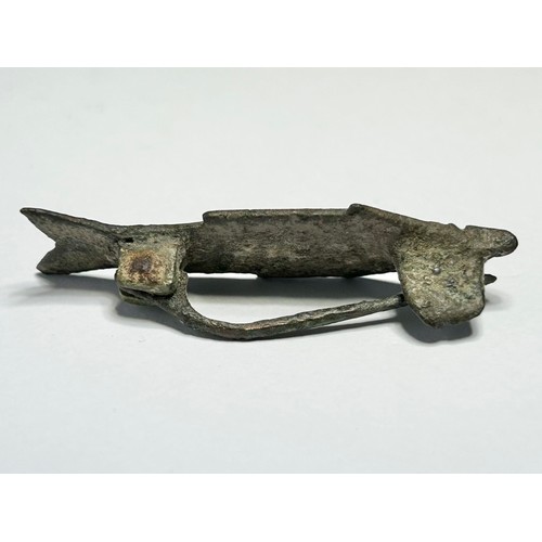 77 - Roman Zoomorphic Brooch. Circa 3rd-4th century CE. Copper-alloy, 45mm x 11mm 5.64 grams. A tinned br... 