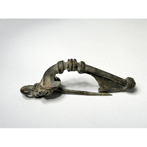 79 - Roman Trumpet Brooch. 2nd-3rd century CE. Copper-alloy, 67mm x 20mm 21.43 grams. An exceptional exam... 