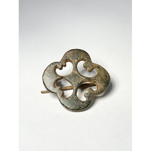 81 - Roman Brooch. Circa 2nd-3rd century CE. An open-work plate type, formed of four back to back crescen... 