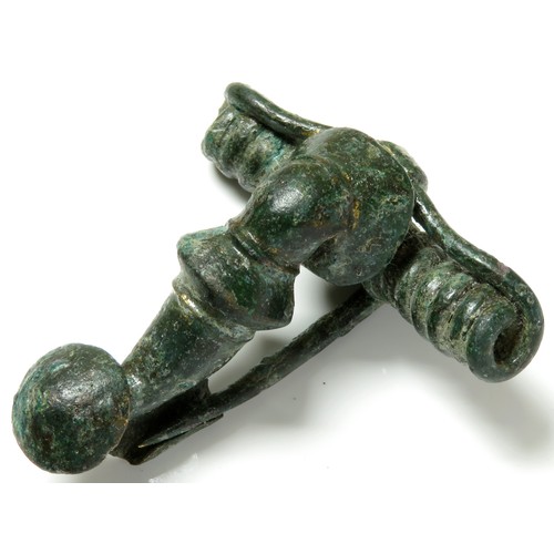 84 - Roman bronze fibula. Circa 1st century CE. Copper-alloy, 47mm x 43mm, 28.9g. A trumpet type with a l... 