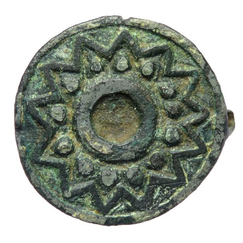 83 - Roman disc brooch c. 2nd century AD. A flat, circular bronze brooch with champleve enamel decoration... 