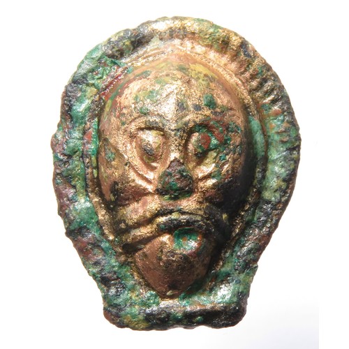 125 - Anglo-Saxon Gilt Face Mount. Circa 6th-7th century CE. Copper-alloy, 25mm x 6mm 7.48g. A heavily gil... 