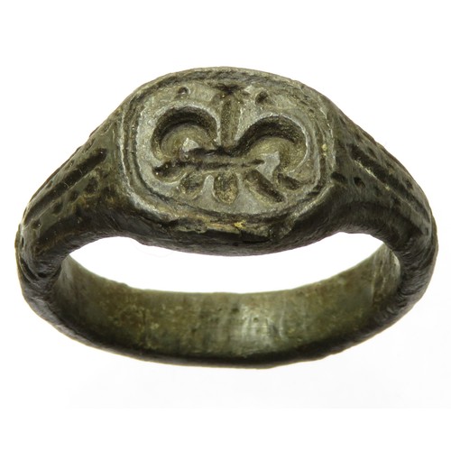 143 - Medieval bronze seal ring. Circa 14th/15th century AD. 33mm diameter, 9.97g, ring size: UK Z; US 12.... 