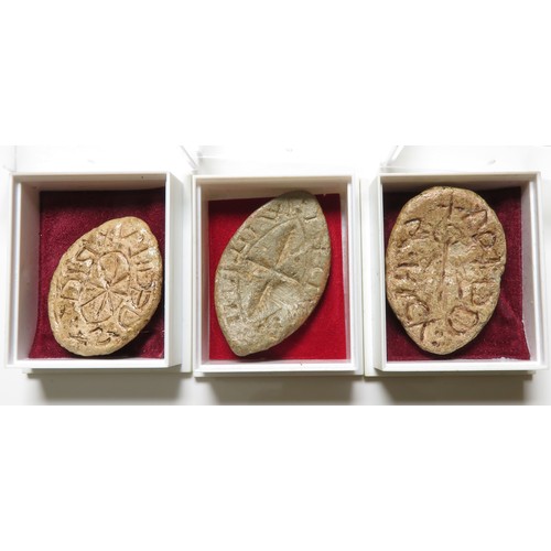 146 - Three medieval lead seal matrices. Oval and Vesica-shaped seals, all personal with central motifs. L... 