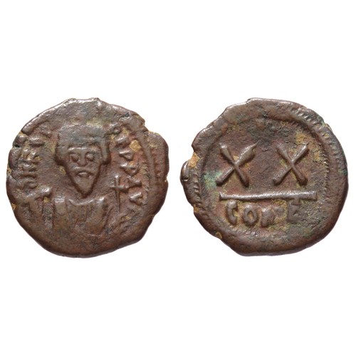 211 - Byzantine. Phocas Ae Half-Follis. Circa 603-610 CE. Copper-alloy, 21 mm. Crowned bust facing, holdin... 