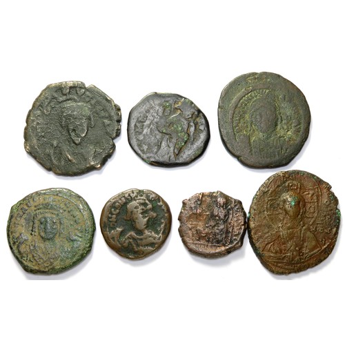 209 - Byzantine AE Coin Group (7). Circa 6th-11th century CE. Copper-alloy, 19mm - 32mm. Issues under, Jus... 