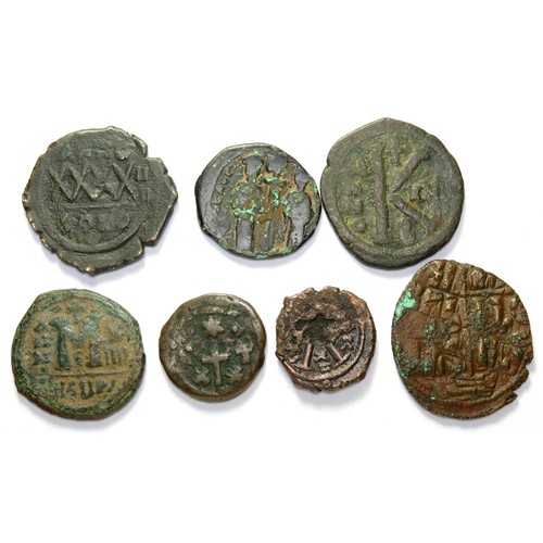 209 - Byzantine AE Coin Group (7). Circa 6th-11th century CE. Copper-alloy, 19mm - 32mm. Issues under, Jus... 