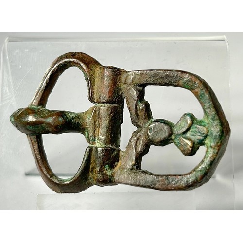 98 - Byzantine Buckle. Circa 5th-7th century CE. Copper-alloy, 45mm x 29mm 19.61g. An exceptional open-wo... 