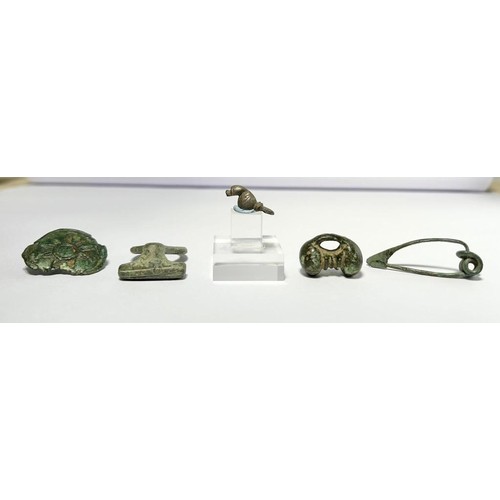 56 - Collection Of Iron Age Artefacts (5). To include, a silver bird mount or amulet, La Tene brooch, sec... 