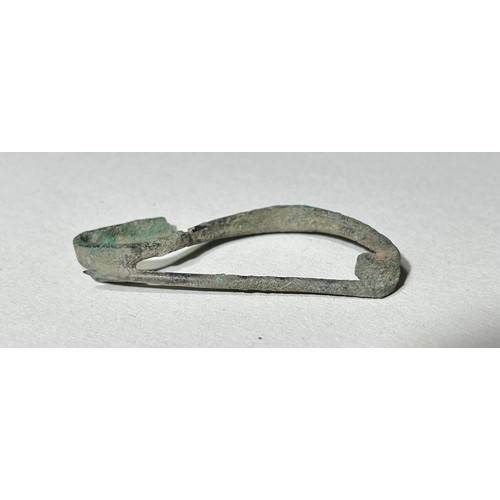 10 - European Iron Age Single Piece Bow-Shaped Brooch. Circa 600 BCE. Copper-alloy, 6.69g. 53.36mm. Itali... 