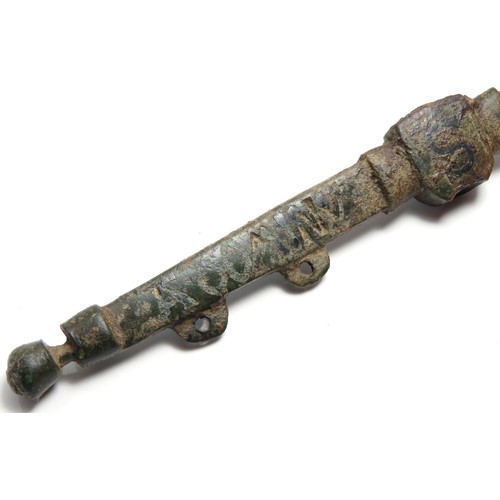 50 - Medieval purse bar. Formed of a central boss with two long arms that extend on either side. Inscribe... 