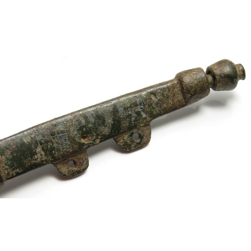 50 - Medieval purse bar. Formed of a central boss with two long arms that extend on either side. Inscribe... 