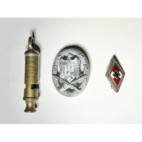 73 - Military Group, WWII German badges (2). Lozenge shaped enamel party badge and a military issue displ... 