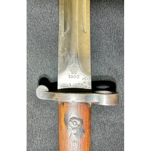 76 - British Military Pattern 1903 sword bayonet, with scabbard. A fine example with two piece wooden gri... 