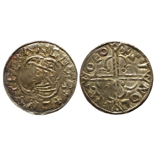 187 - Cnut, 1016-1035 AD. Quatrefoil type penny. Silver, 1.00g. 19.22 mm. +CNVT REX ANGLO, crowned bust le... 